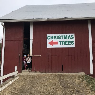 Christmas Tree barn with sign and children
